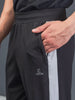 "DynamicFlex Men's Black 4-Way Lycra Track Pants: Unleash Your Movement"